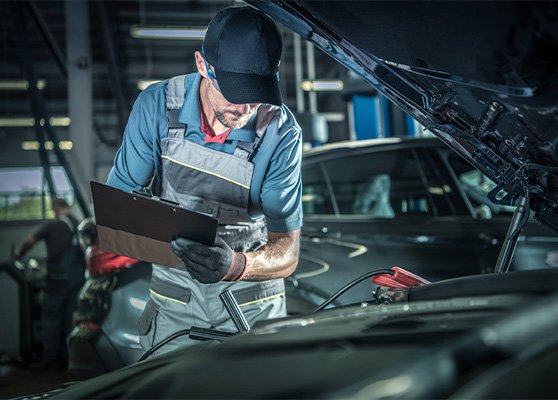 Expert mechanic repairing car