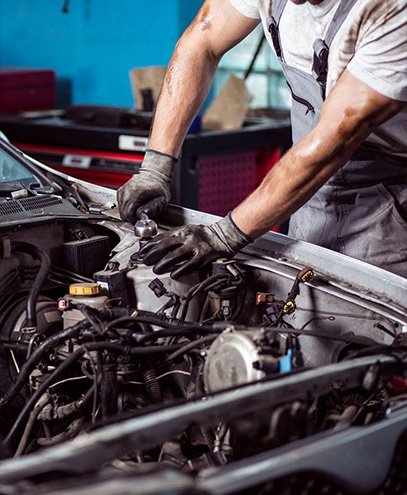 Expert mechanic repairing car