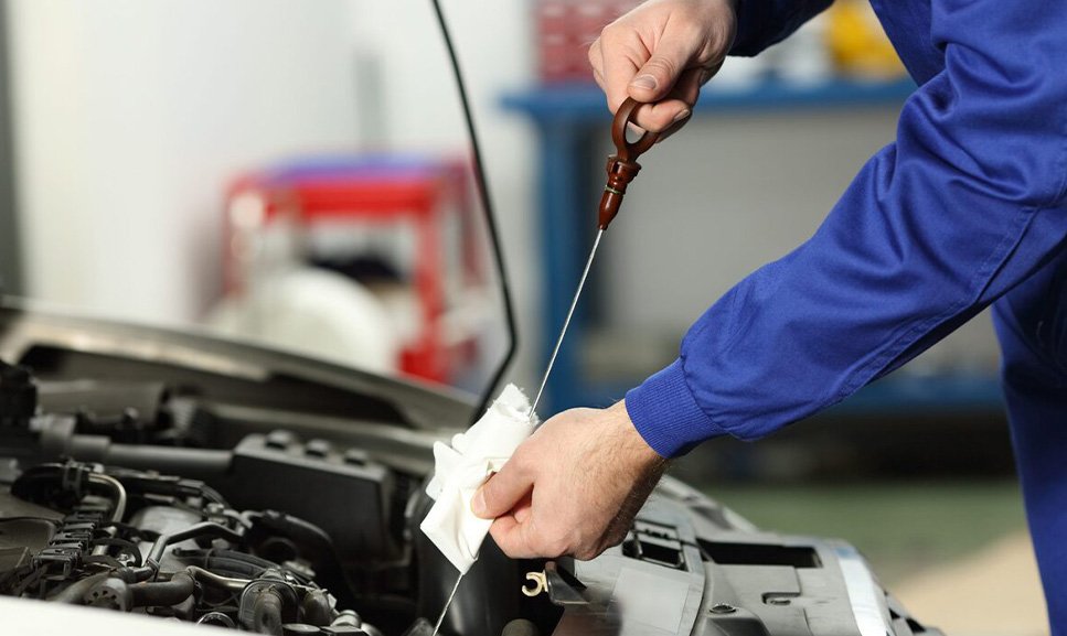 Close-up of a car engine being inspected. Essential car maintenance tips for all drivers.